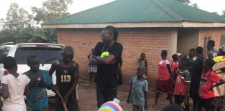 Pallaso conversing with residents of Kyampisi during his brief visit