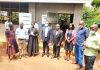 Regional farmers take a group photo with Giles Aijukwe CEO Letshego and Letshego board director Peter Masaba (Center) during ILC Poultry project handover in Wakiso district